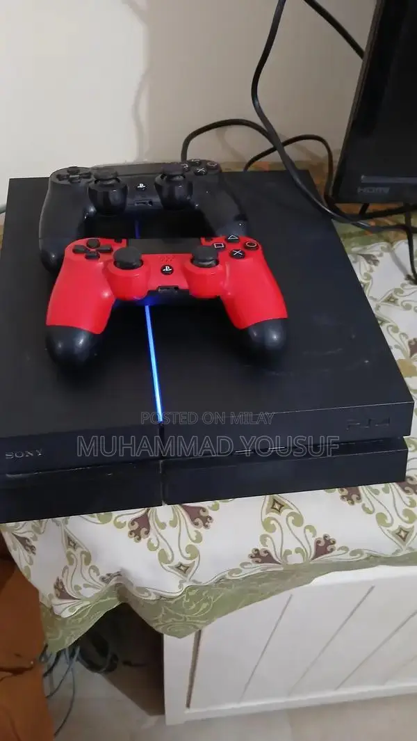 Sony PlayStation 4 Gaming Console with Dual Controllers