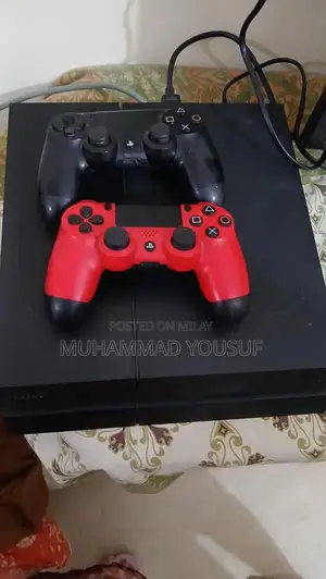 Sony PlayStation 4 Gaming Console with Dual Controllers