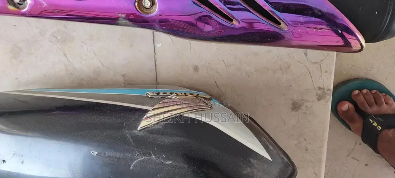 Honda 125cc Motorcycle Parts - Side Cover and Silencer