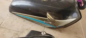 Honda 125cc Motorcycle Parts - Side Cover and Silencer