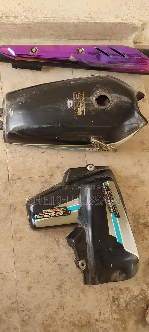 Honda 125cc Motorcycle Parts - Side Cover and Silencer