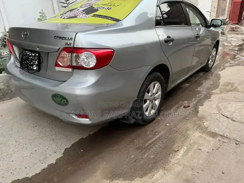 Toyota GLI Silver Sedan - Well Maintained Condition