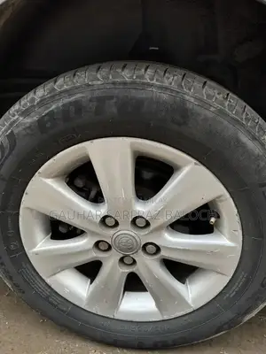 Toyota GLI Silver Sedan - Well Maintained Condition