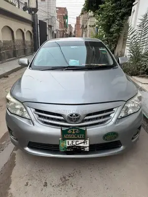 Toyota GLI Silver Sedan - Well Maintained Condition