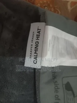 Physiotherapy Heat Massaging Weighted Heating Pad by Sharper Image