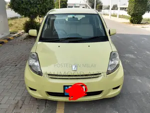 Photo - Toyota Passo 1.0 FWD 2010 Yellow