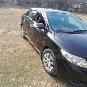 Toyota Corolla Base 4dr Sedan (1.8L 4cyl 5M) 2010 Black