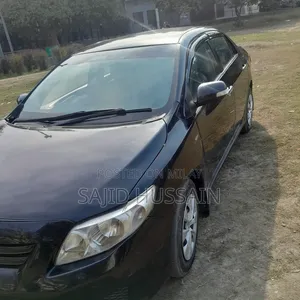 Toyota Corolla Base 4dr Sedan (1.8L 4cyl 5M) 2010 Black